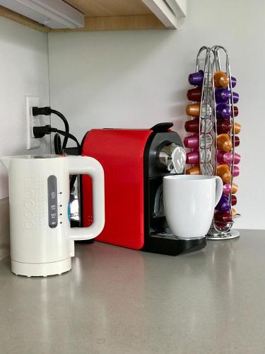 a toaster and a coffee maker on a kitchen counter at Birdhouse on Green Lake in Seattle
