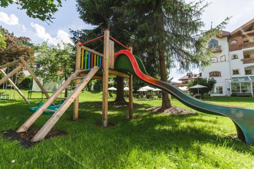 a playground with a slide in a park at Gaspingers Bergjuwel in Gerlos