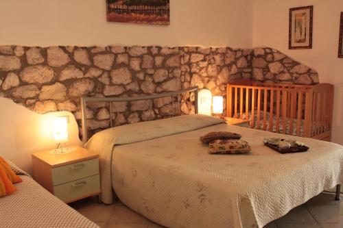 A bed or beds in a room at Agriturismo IL CANTINIERE