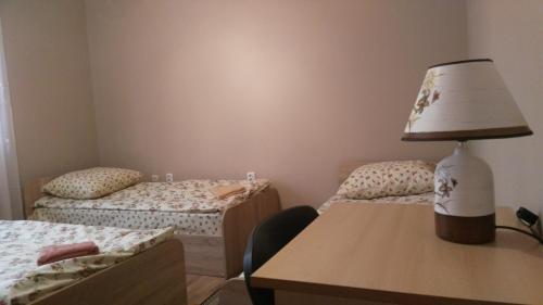 Postel nebo postele na pokoji v ubytování Apartments I & I