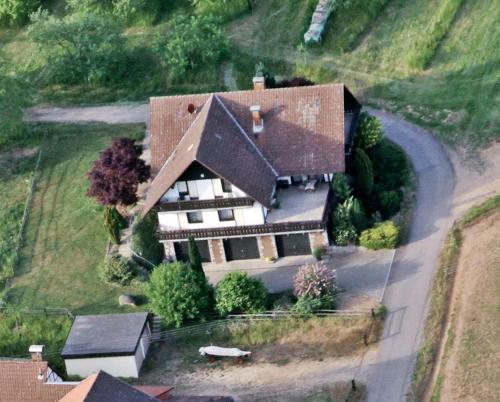 an overhead view of a large house on a hill at Ferienwohnung Edelbrenner in Rimbach