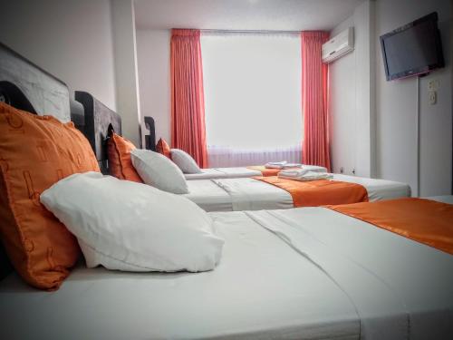 Säng eller sängar i ett rum på Hotel el Atajo