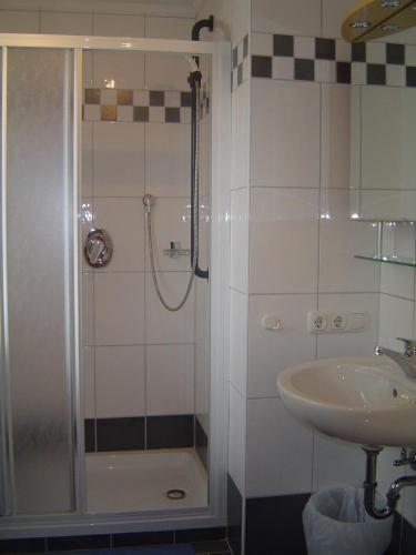 a bathroom with a shower and a sink at Foidl Simon in Fieberbrunn