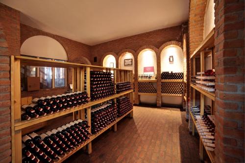 a wine cellar with racks of wine bottles at VINIFERA VINEYARDS HOTEL in Selcuk