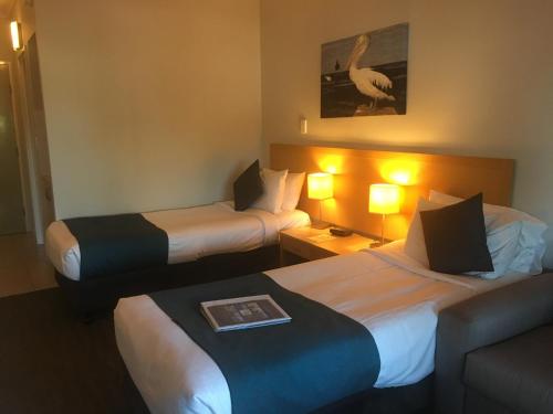 Postel nebo postele na pokoji v ubytování Manly Marina Cove Motel