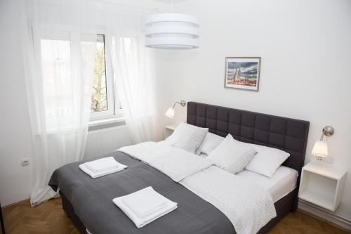 Krevet ili kreveti u jedinici u objektu Deluxe Apartments Zagreb