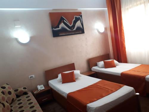 Postel nebo postele na pokoji v ubytování Hotel Flormang