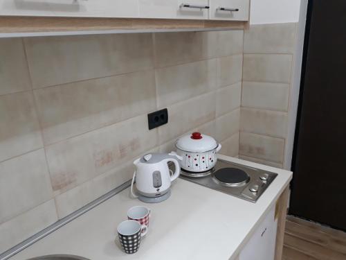 Coffee and tea making facilities at Sweet Yellow Apartment