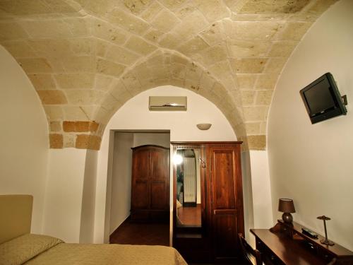 TV a/nebo společenská místnost v ubytování Masseria La Porticella
