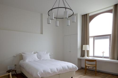 Voodi või voodid majutusasutuse Hotel Wu Wei toas