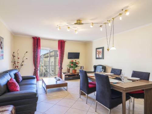 a living room with a table and a dining room at Apartment T2 Olhão by Interhome in Olhão