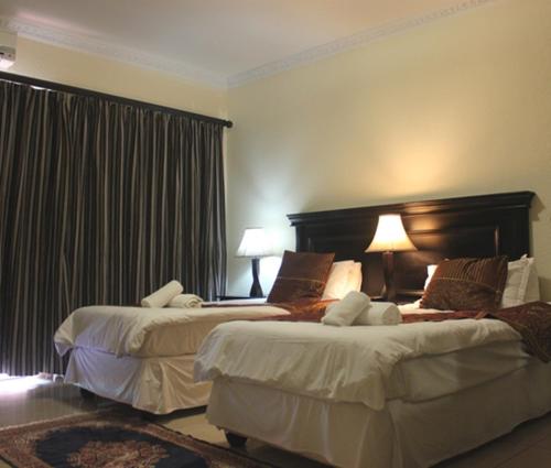 Postel nebo postele na pokoji v ubytování Rosenthal Guesthouse