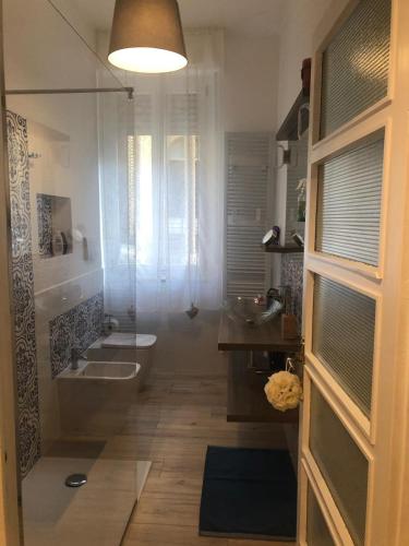 a bathroom with a shower and a toilet and a sink at CittadellaChiara in Sestri Levante