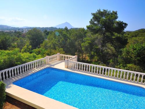 a swimming pool with a white rail around it at Holiday Home Balcon al Mar by Interhome in Balcon del Mar