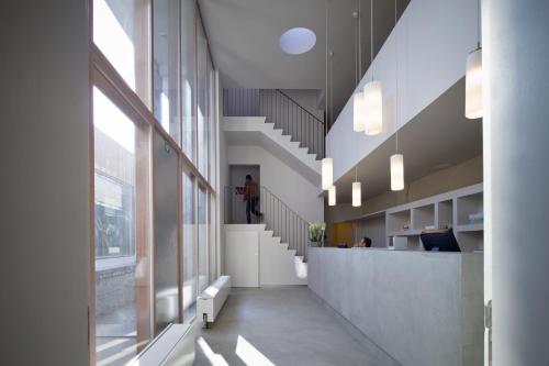 a hallway with a staircase in a building at Hotel Wu Wei in Kortrijk
