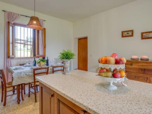 a kitchen with a bowl of fruit on a counter at Villa Beboli by Interhome in Lamporecchio