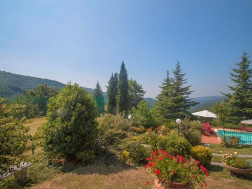 a view of a garden with a swimming pool at Villa Villa Campo del Mulino by Interhome in Piteccio