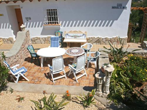 a patio with a table and chairs on a brick patio at Holiday Home Monte y Mar by Interhome in Monte Pego