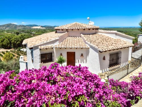 a house with purple flowers in front of it at Villa Villa Clementina by Interhome in Monte Pego