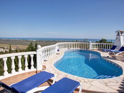 a swimming pool on a balcony with two chairs at Villa Ma-Nita by Interhome in Monte Pego