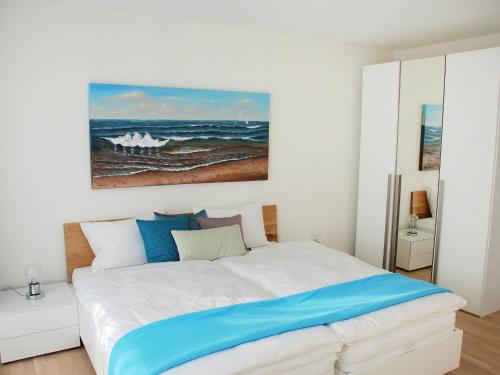a bedroom with a bed with a painting on the wall at Apartment LaVille B-2-3 by Interhome in Locarno