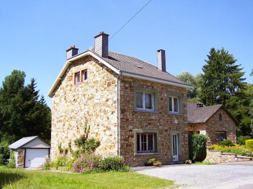 a large stone house with a roof at Holiday Home Vielsalm by Interhome in Vielsalm