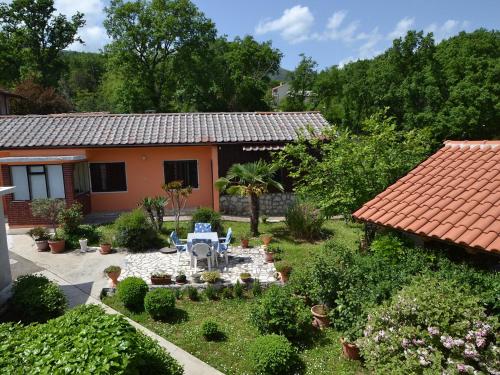 an aerial view of a garden in front of a house at Holiday Home Franjo-2 by Interhome in Ika