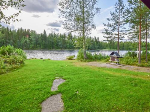 A garden outside Holiday Home Sieralahden lomakylä- nr 1 by Interhome