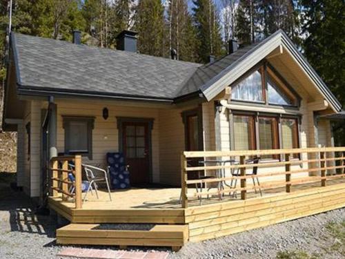 a small house with a porch and a deck at Holiday Home Vuoristomaja by Interhome in Kittilä