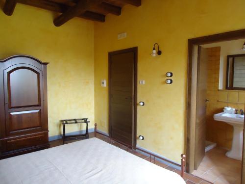 Кровать или кровати в номере Masseria Campierti