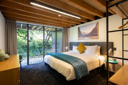 Säng eller sängar i ett rum på Koura Apartments Central Queenstown
