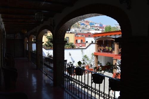 an archway in a building with a view of a city at Hotel Dos Rios in Guanajuato