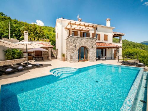 an image of a villa with a swimming pool at Villa Marone by Interhome in Dobreć