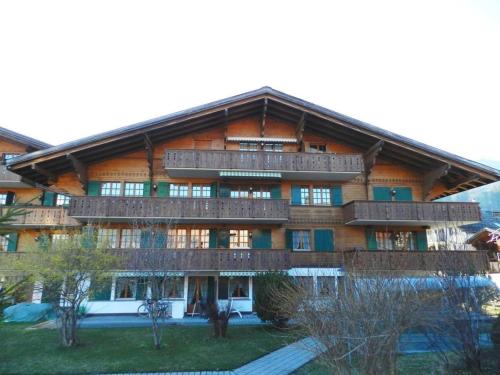 a large building with balconies on the side of it at Apartment Gessenay 13 by Interhome in Gstaad