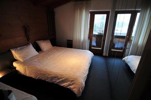 מיטה או מיטות בחדר ב-Huis Fitaniki