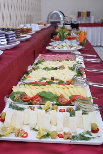 a row of plates of food on a table at Hotel Avcilar City in Avcılar