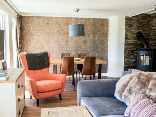 a living room with a couch and a table at Holiday Home Taobh na Mara by Interhome in Kensaleyre