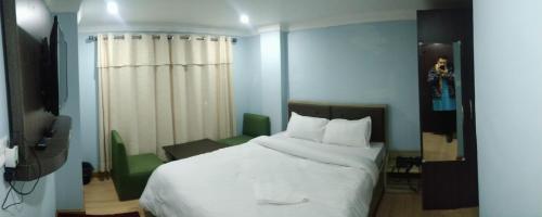 Postel nebo postele na pokoji v ubytování Hotel Samrajya Pvt. Ltd.