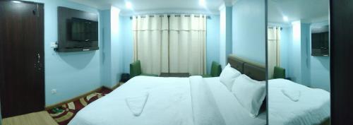 Postel nebo postele na pokoji v ubytování Hotel Samrajya Pvt. Ltd.