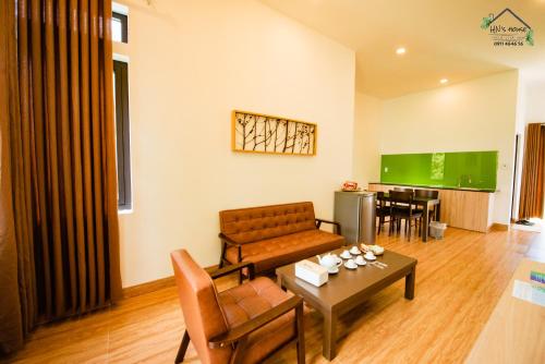 a living room with a couch and a table at Hoàng Ngọc's House in Tuy Hoa