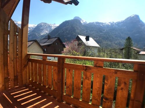 a wooden balcony with a view of a mountain at B&B Simmer in Obertraun