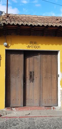 a pair of wooden doors on a building at Hotel Real Antigua in Antigua Guatemala