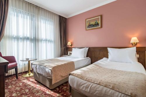 Säng eller sängar i ett rum på Hotel 2000 Kavaklıdere