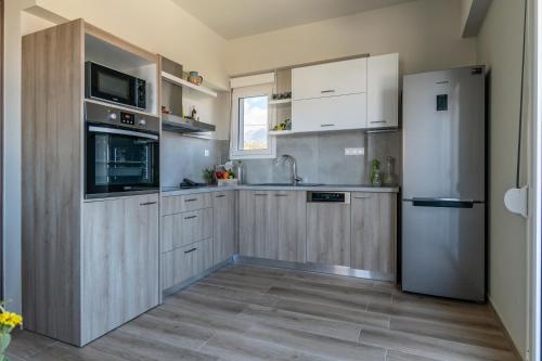 A kitchen or kitchenette at Kyma seaview Apartments, Episkopi beach Rethymno