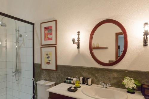 a bathroom with a sink and a mirror at Nyne Hotels - Leela Walauwwa, Induruwa in Induruwa