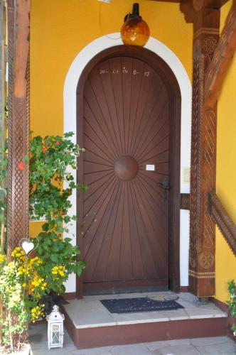 a large wooden door with a gate in a building at Ferienwohnung Hinterdorfer in Unterweissenbach