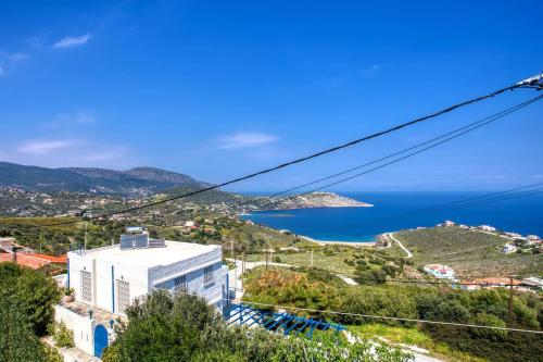 a view of a city and the ocean at A gem next to the sea and close to the airport in Dhaskalión