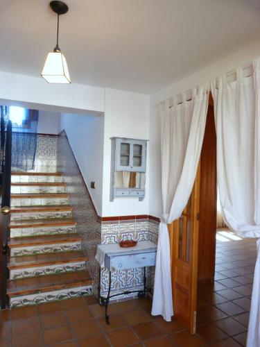 a staircase in a home with a stair case at Las mil y una noches in Tramacastilla