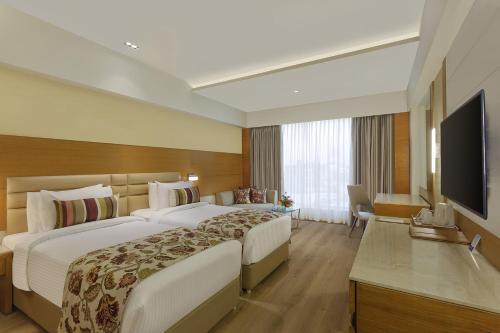 Nataraj Sarovar Porticoにあるテレビまたはエンターテインメントセンター