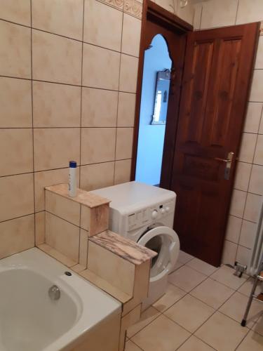 a bathroom with a toilet and a sink and a mirror at Traditional Mansion Calliopec-UVC sterilized in Makrinítsa